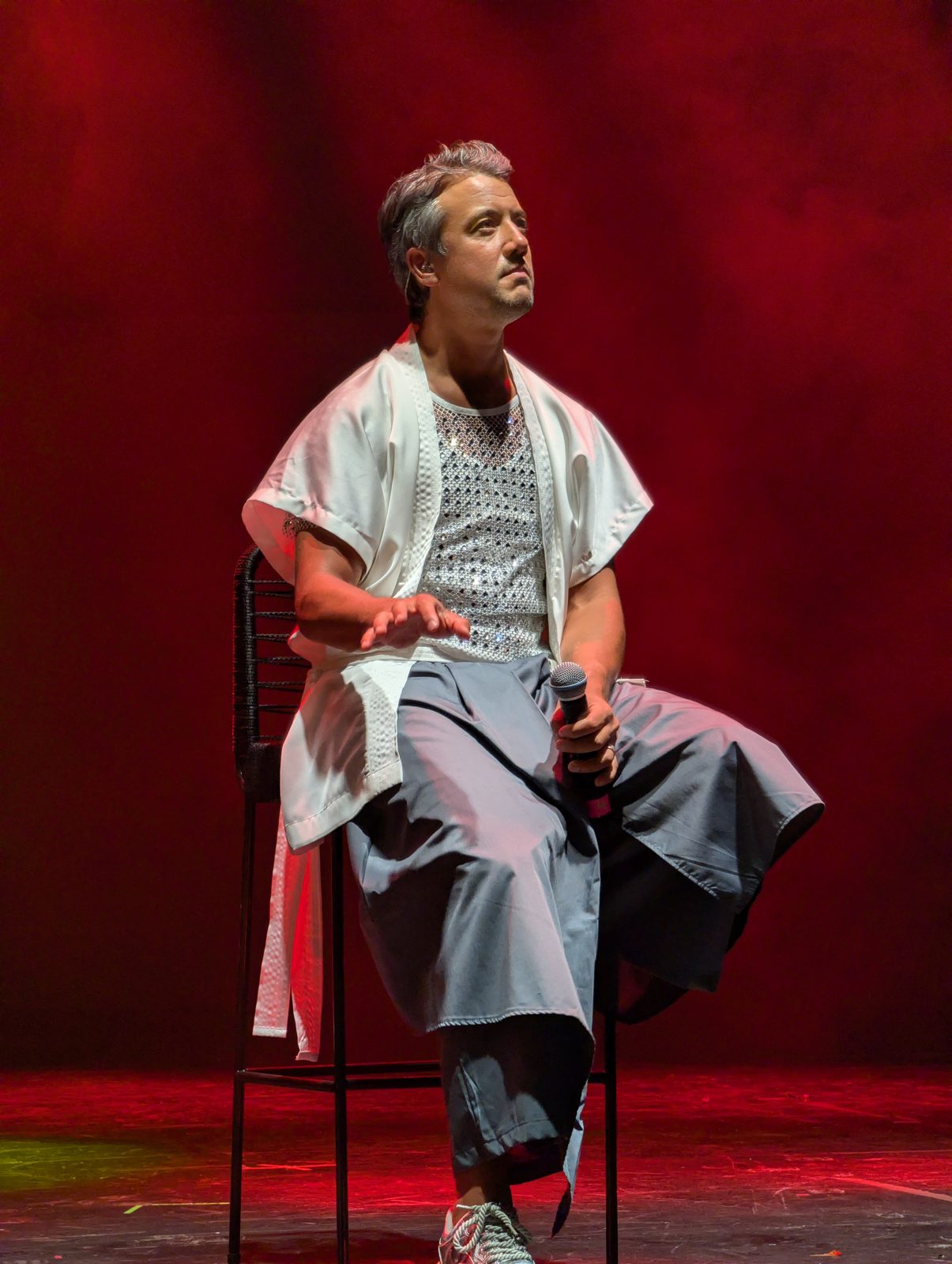 A*Teens member seated on stage answering questions in Buenos Aires, 2025