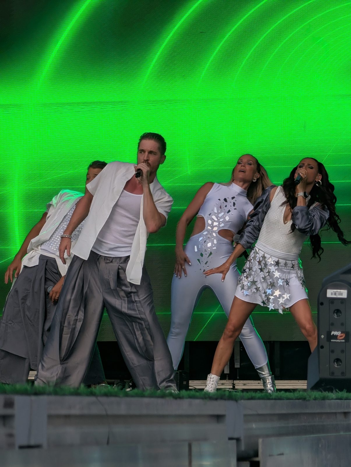 All four A*Teens members performing together on stage in Madrid, 2025