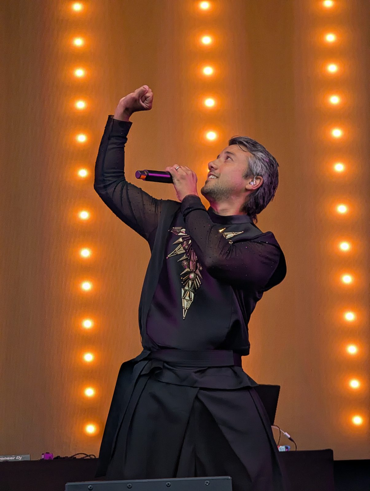 A*Teens member with fist raised on stage in Trondheim, 2025